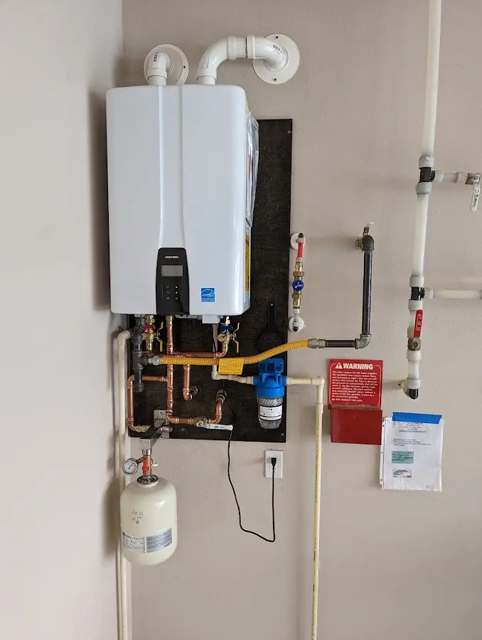 Professional plumber installing copper piping in a Bayou Vista home